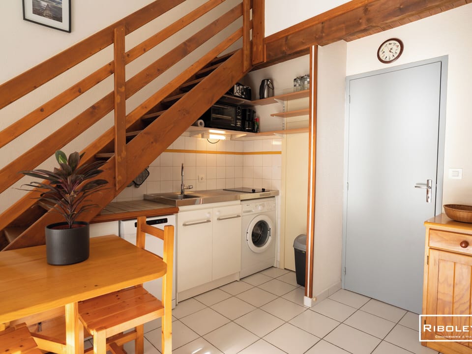 Kitchen opening onto living room