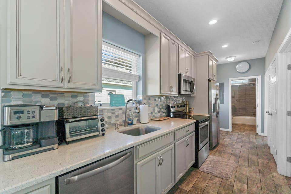 Your fully equipped kitchen features stainless steel appliances, granite countertops, and everything needed to create delicious meals during your stay.