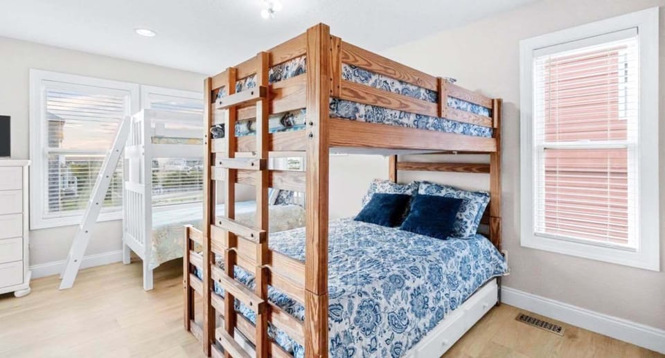 Cozy bunk room with plenty of sleeping space, natural light, and modern comfort.