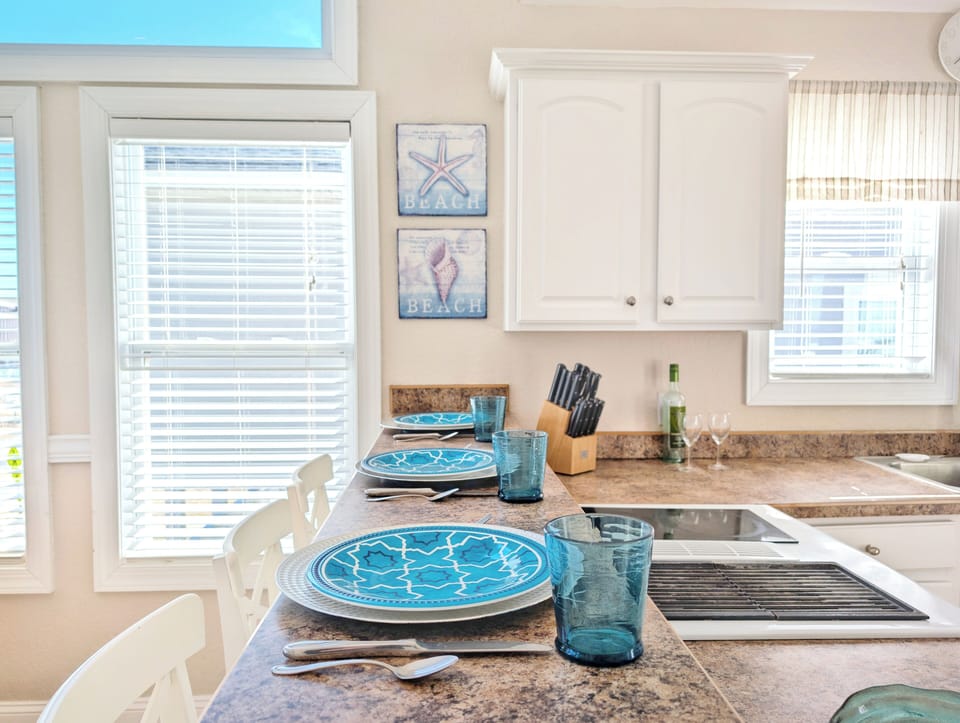 Cozy kitchen with bar seating, fully equipped for family meals and casual dining