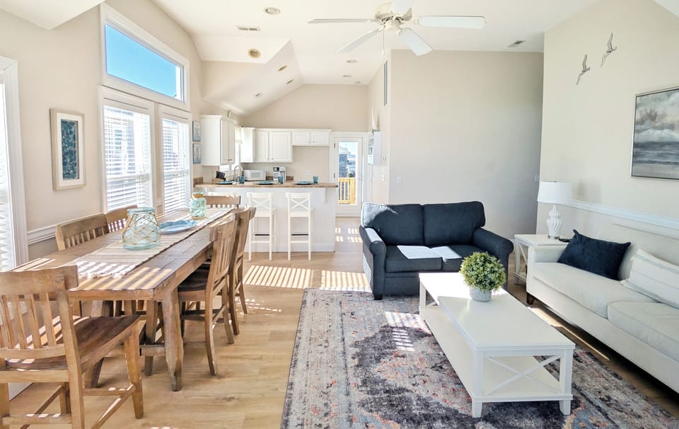 Open layout with dining, living, and kitchen areas,perfect for family gatherings