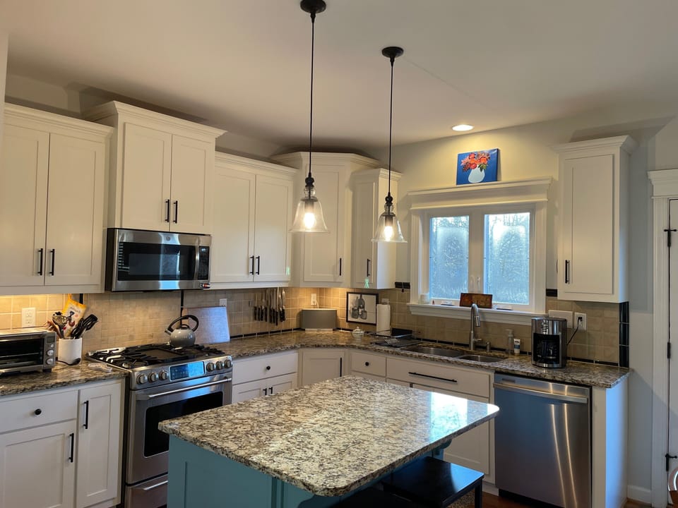 Kitchen with island and barstools