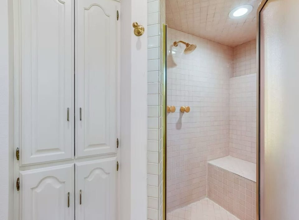 upstairs bathroom with shower off king bedroom
