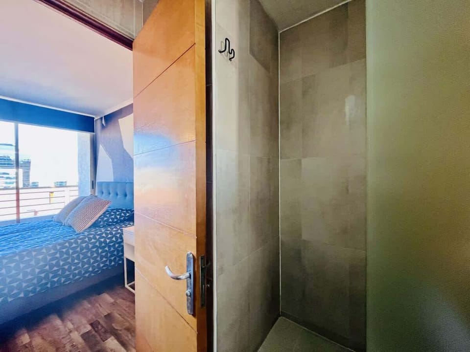 Glass-enclosed shower offering a sleek, modern bathroom feel.