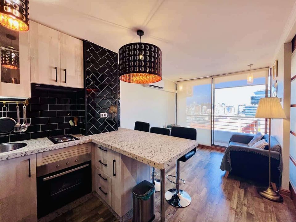 Spacious kitchen & dining combo w/ wood cabinets & natural light.