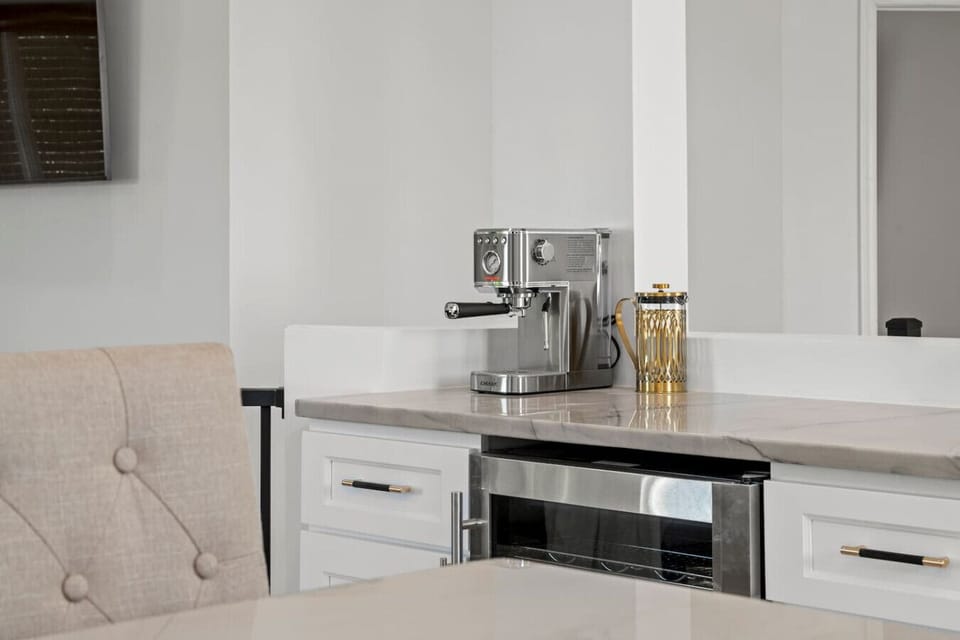 A cozy view of the coffee maker in the kitchen, ready to brew your perfect cup of coffee!