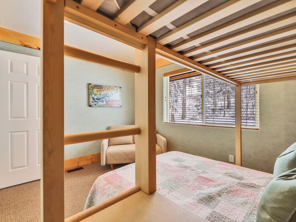 Bedroom 3 equipped with twin over double bunk bed and custom chandelier