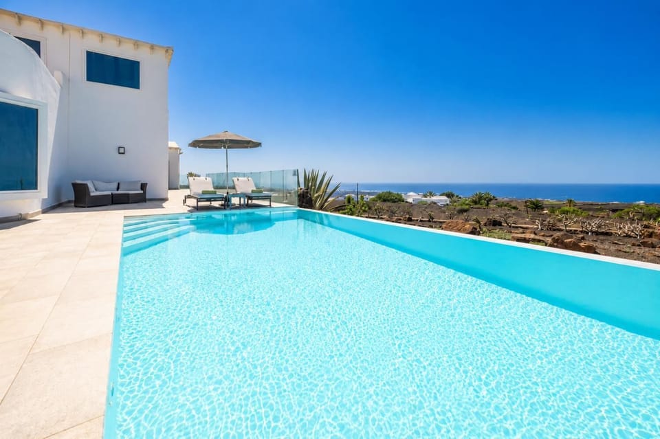 Private pool, terrace, and garden with panoramic sea views