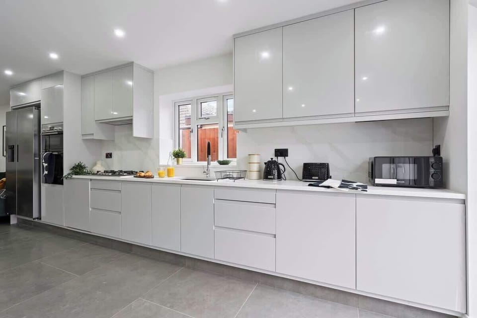 Modern kitchen with plenty of cooking utensils. microwave, kettle and toaster 