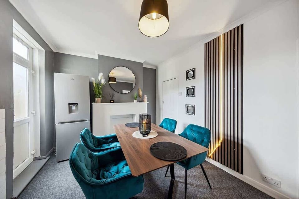 A dining area with a table and chairs, perfect for enjoying meals and spending quality time together.
