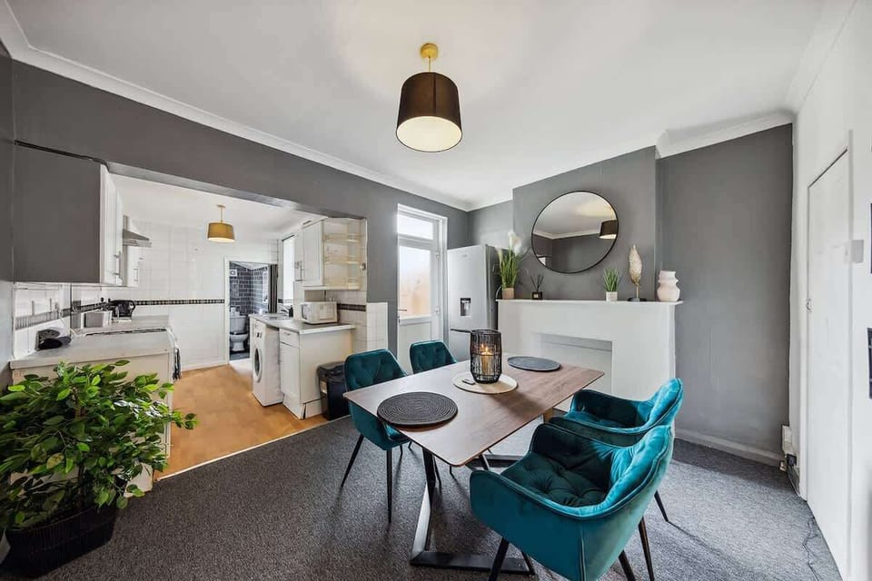 A dining area with a table and chairs, perfect for enjoying meals and spending quality time together.
