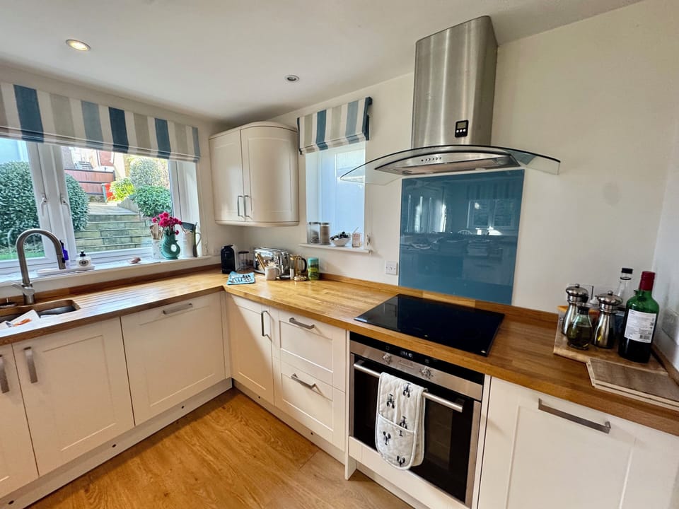 Well equipped open plan kitchen overlooking the garden