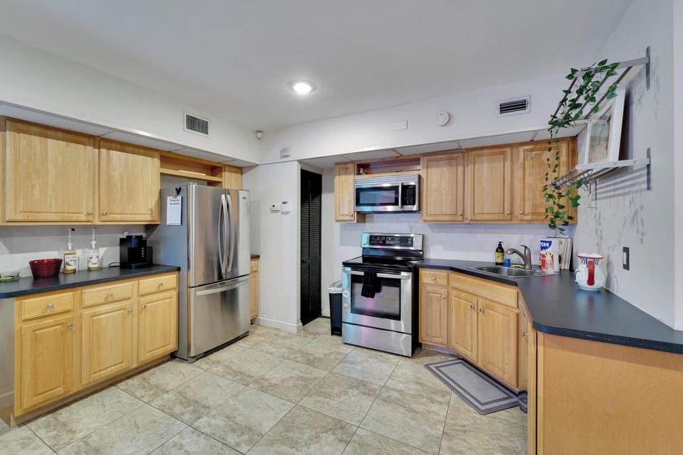 Fully equipped kitchen with coffee maker for an enjoyable cup of coffee.