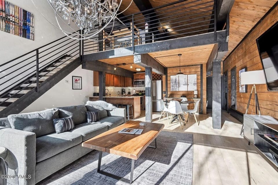 Living room looking up to the loft. 