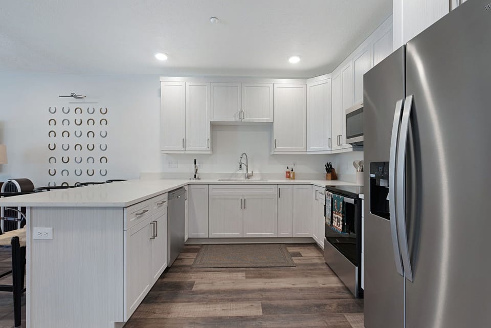 All the cookware you need for hosting big groups! Propane grills located outside