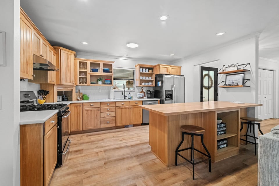 Front entry leads into open concept kitchen, living, & dining! Pantry in hall!