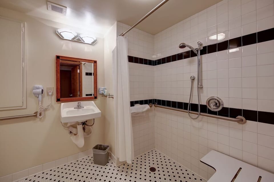 Rinse off comfortably in a spacious walk-in shower with grab bars.