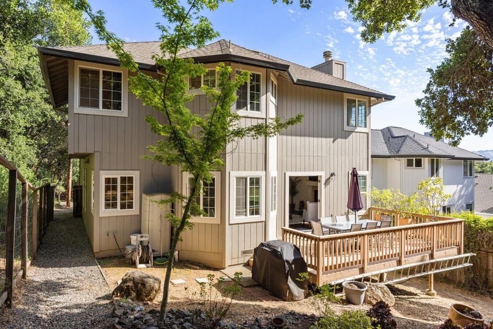 Outdoor seating, grill, and natural landscape