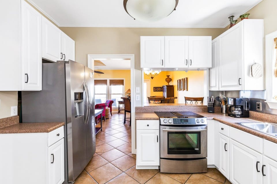 Everything you need to create your favorite meals in your home away from home. Stainless steel appliances, countertop conveniences, and plenty of cabinet space make this space a chef's delight.