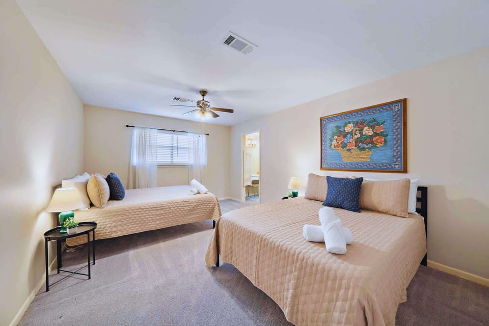 Spacious Guest Room: Bright and inviting with two comfy beds and lovely decor for a restful retreat!