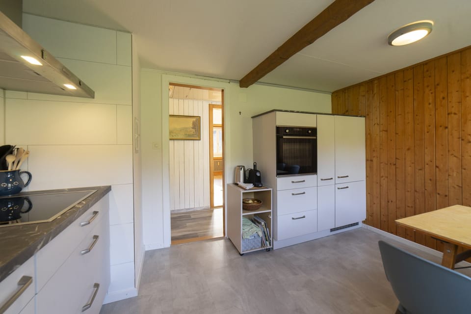 Kitchen with dining area and wooden details