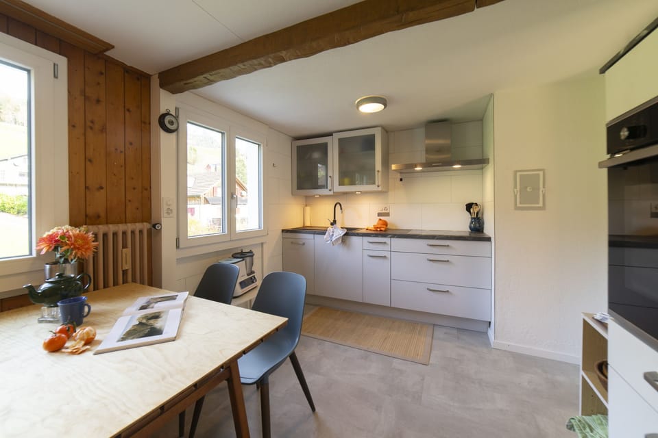Modern kitchen with dining area and wooden details