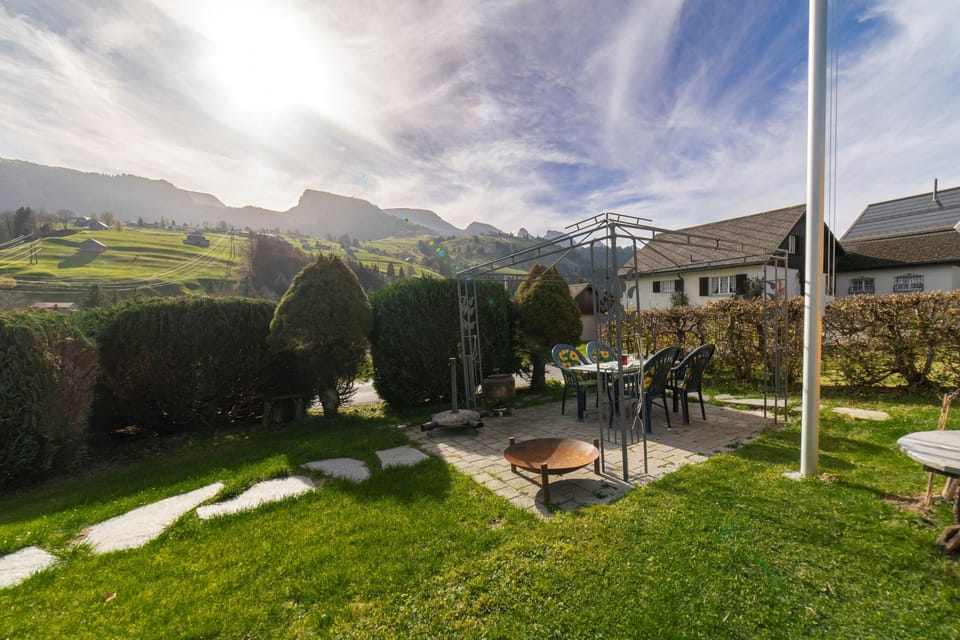 Garden with seating area and views of the Toggenburg mountains
