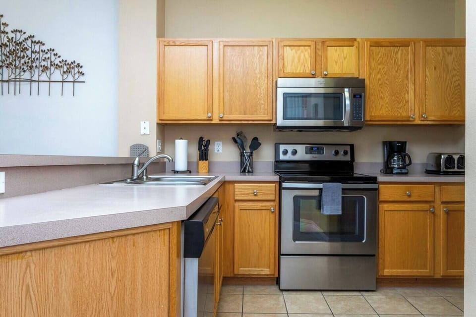 The cozy kitchen is equipped with the essentials for preparing simple meals and enjoying a casual dining experience
