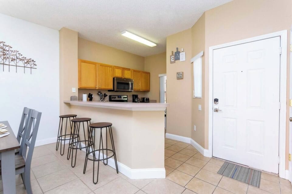 The cozy kitchen is equipped with the essentials for preparing simple meals and enjoying a casual dining experience
