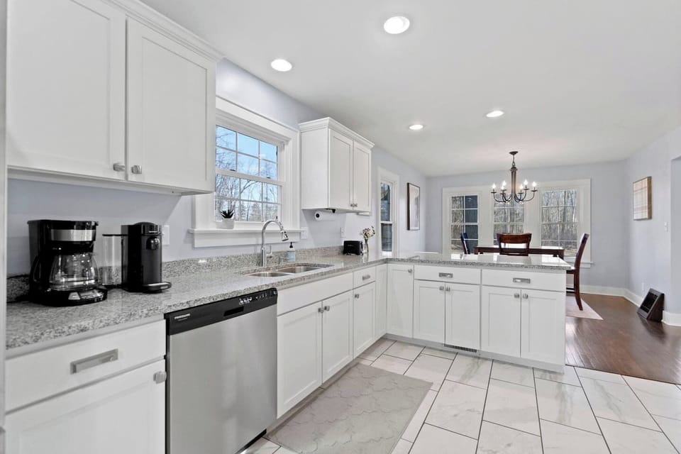 Bright, spacious, and well equipped-- this kitchen is the perfect place to cook relax, and enjoy your stay! 