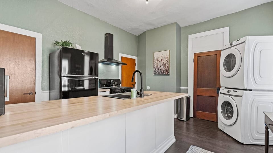 Fully equipped kitchen with in home laundry. 