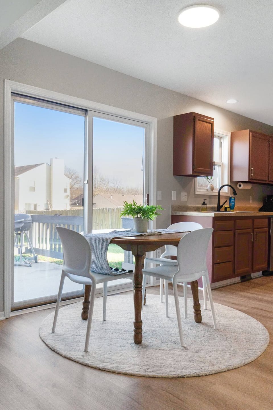 Enjoy cozy meals and good company in this charming dining space, perfect for 3 and just steps from the kitchen. 