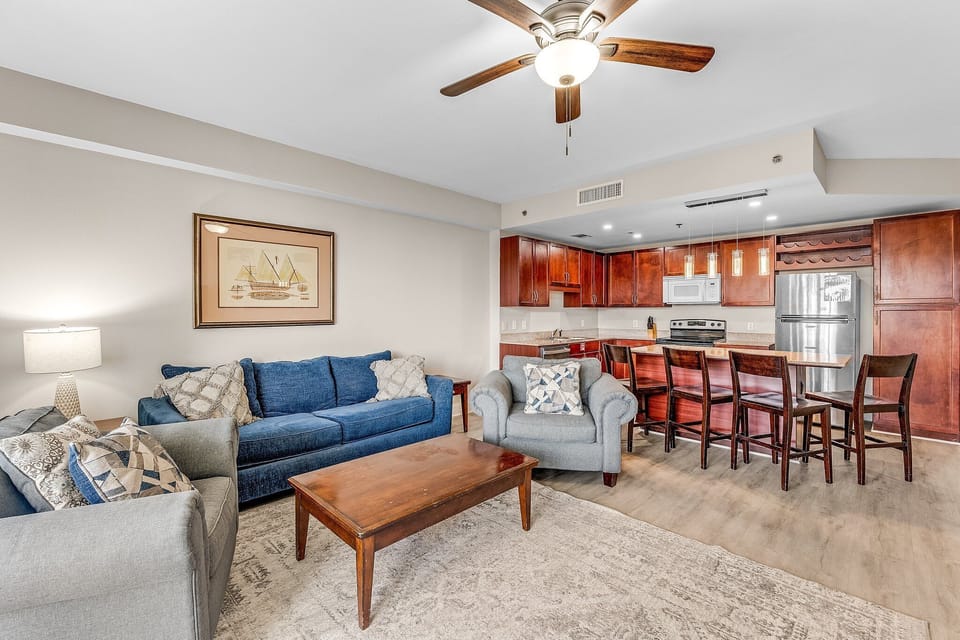Open-concept living area with modern kitchen and comfortable seating.
