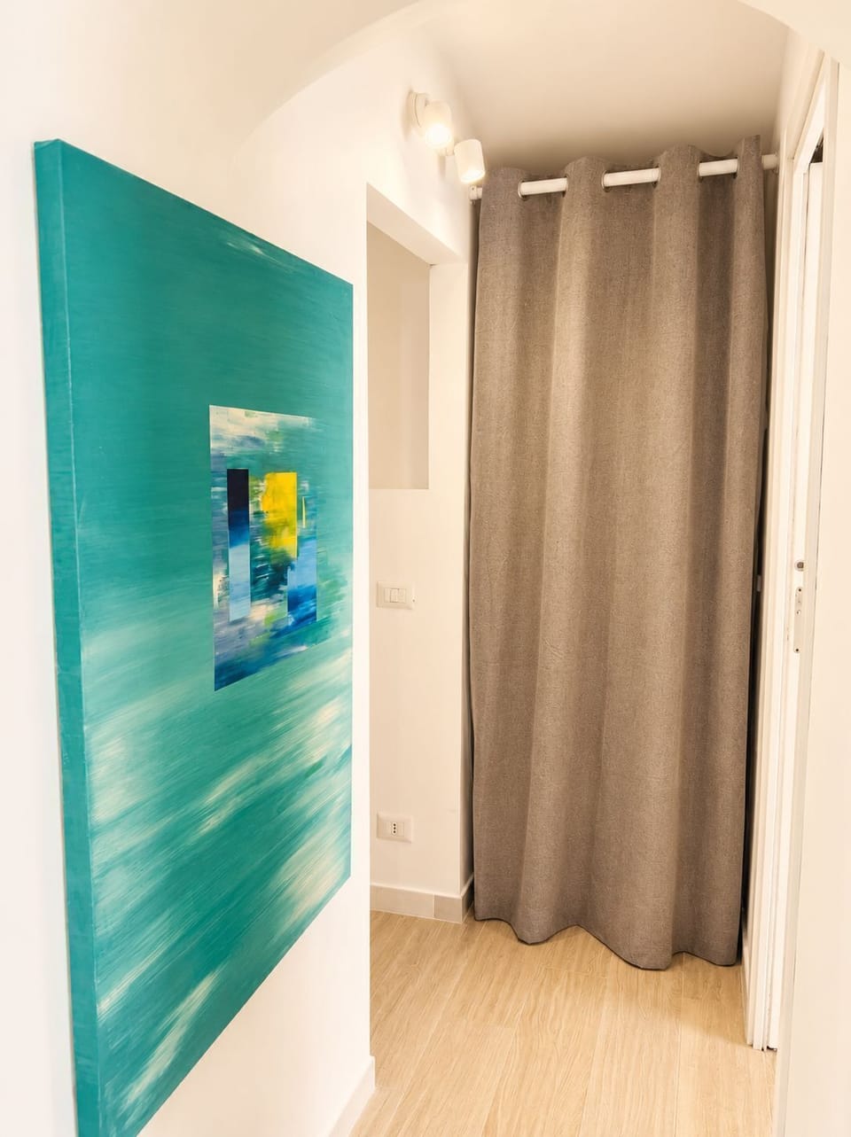 A practical and thoughtfully designed space featuring a dedicated laundry area and spacious walk-in closet, ideal for keeping your stay organized and comfortable.