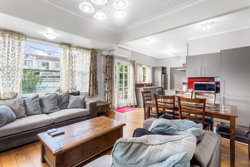 The open plan living spaces include the kitchen, dining and lounge spaces.