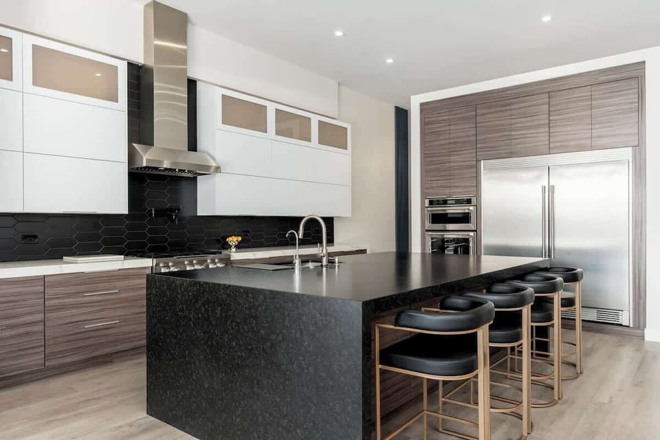 Your private chef's kitchen awaits, with sleek granite countertops, stainless steel appliances, and a spacious island perfect for meal prep or morning coffee with loved ones.