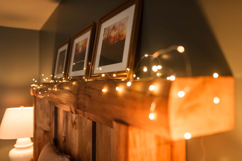 Warm wood and lighting creates a comfortable and welcoming atmosphere.