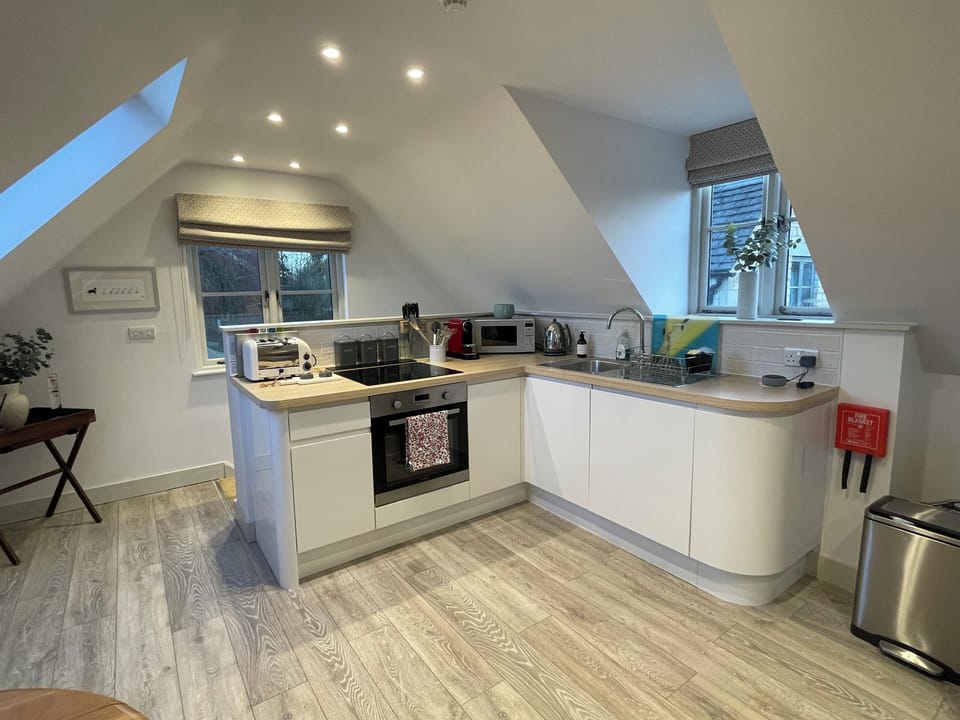 The fully equipped kitchen includes a Nespresso machine and coffee pods. 