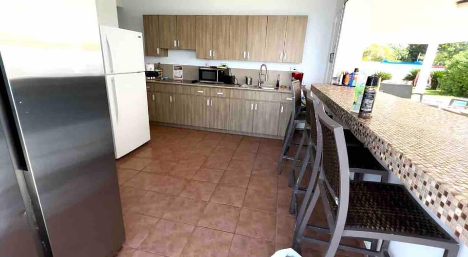 Fully equipped outdoor kitchen with two refrigerators. Bring your apron and chefs hat because you will enjoy cooking with a view!