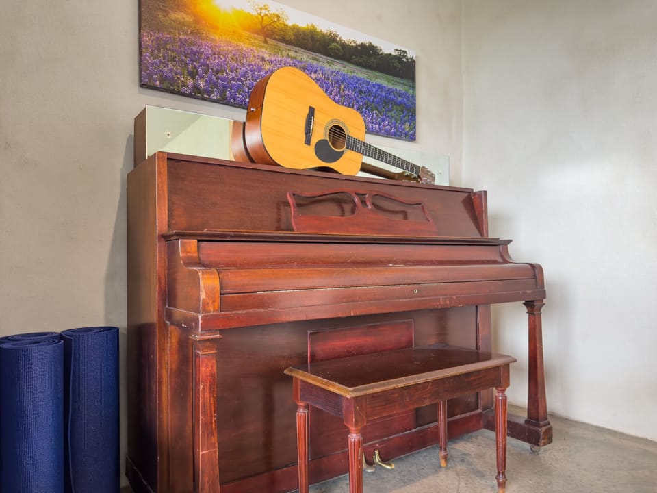 Tuned piano & acoustic guitar ready for a duet.