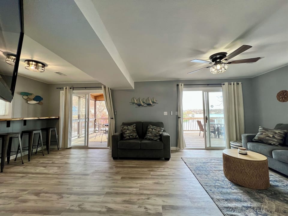 Living Room with queen sofa sleeper and 2 walk-out options.