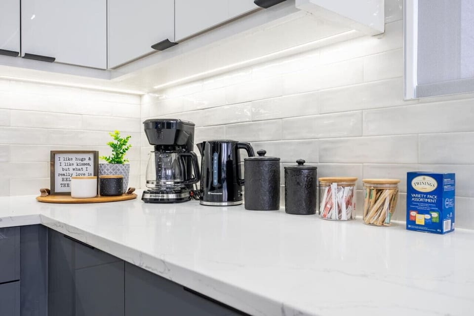 Start your day at the well-stocked coffee station, featuring a curated selection of premium coffees and teas. Enjoy a cozy, personalized morning ritual that makes every day of your stay feel just like home.