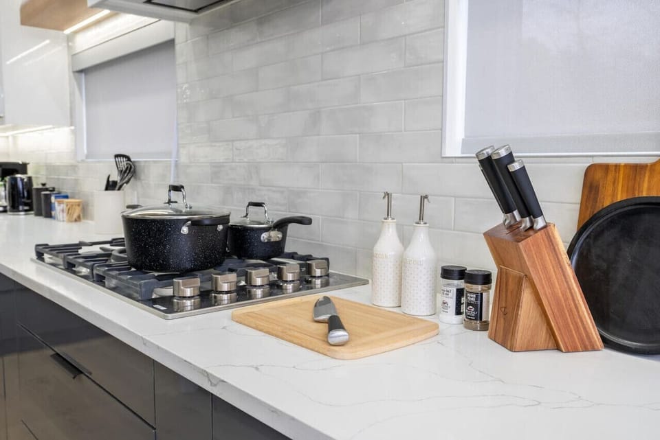 Enhance your stay in this luxury, fully stocked kitchen — perfect for creating delicious meals and memorable moments. Enjoy the art of cooking in a space designed for both style and function.