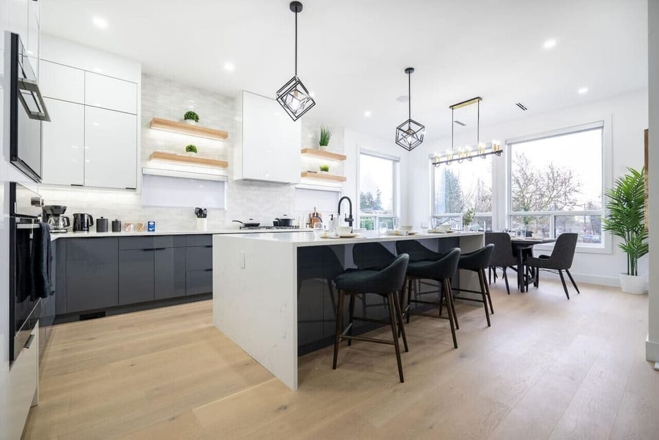 Enjoy culinary luxury in this modern designer kitchen featuring high-end appliances, a spacious island, and elegant finishes — the perfect blend of style and functionality for your stay.