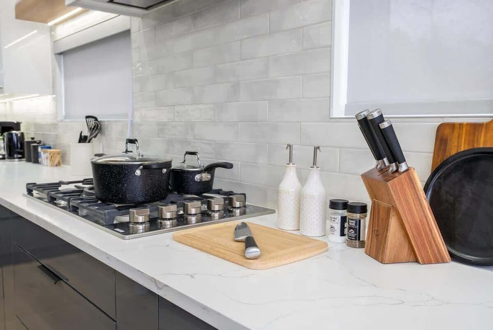 Enhance your stay in this luxury, fully stocked kitchen — perfect for creating delicious meals and memorable moments. Enjoy the art of cooking in a space designed for both style and function.