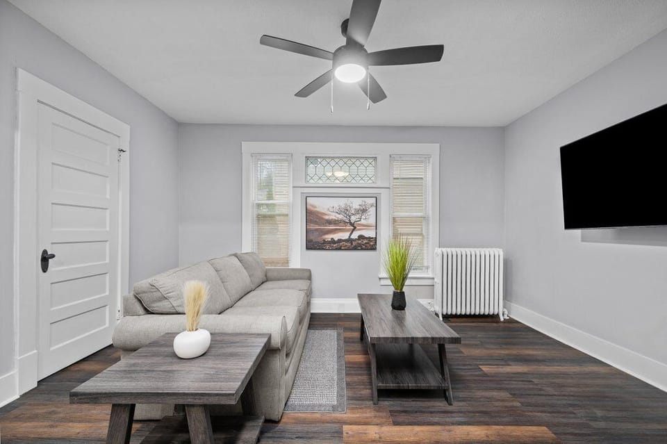 Inviting living room space with a large TV and plenty of room for relaxation