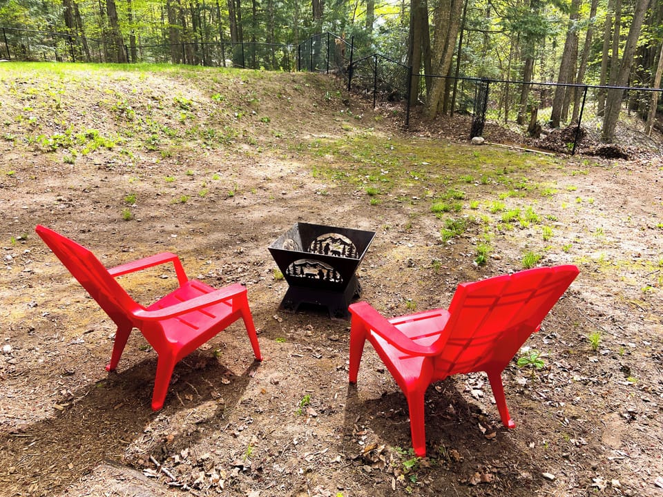 Fire pit in fenced backyard