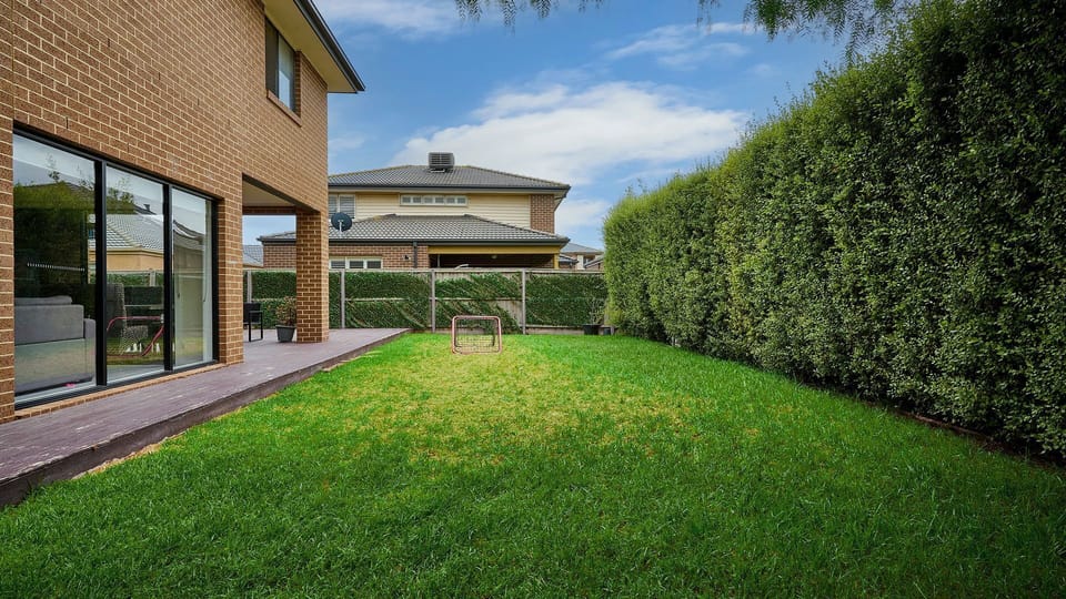 The property features a spacious backyard, perfect for outdoor activities and relaxation.