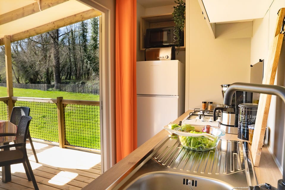 Step into this inviting kitchen, designed for family gatherings, where cooking delightful meals becomes a joy as you enjoy the views of the expansive outdoor space.