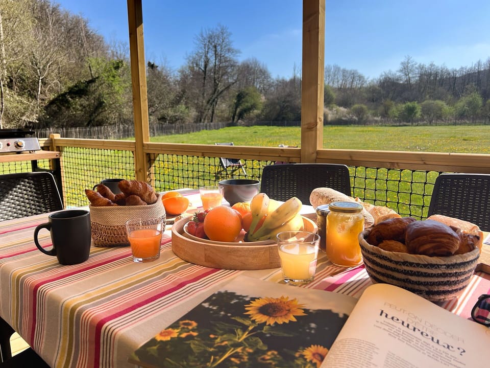 Enjoy leisurely breakfasts on the spacious terrace, surrounded by nature, where families can unwind over delicious treats and refreshing drinks.